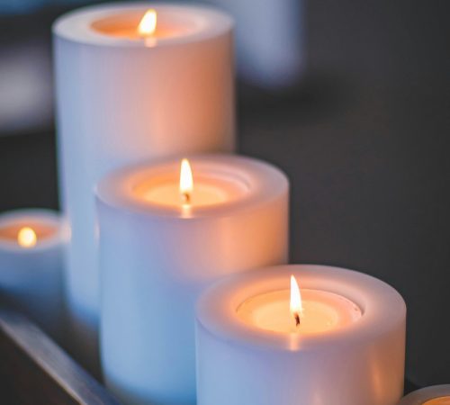 A close-up of a serene candlelight arrangement with a soft, soothing glow.